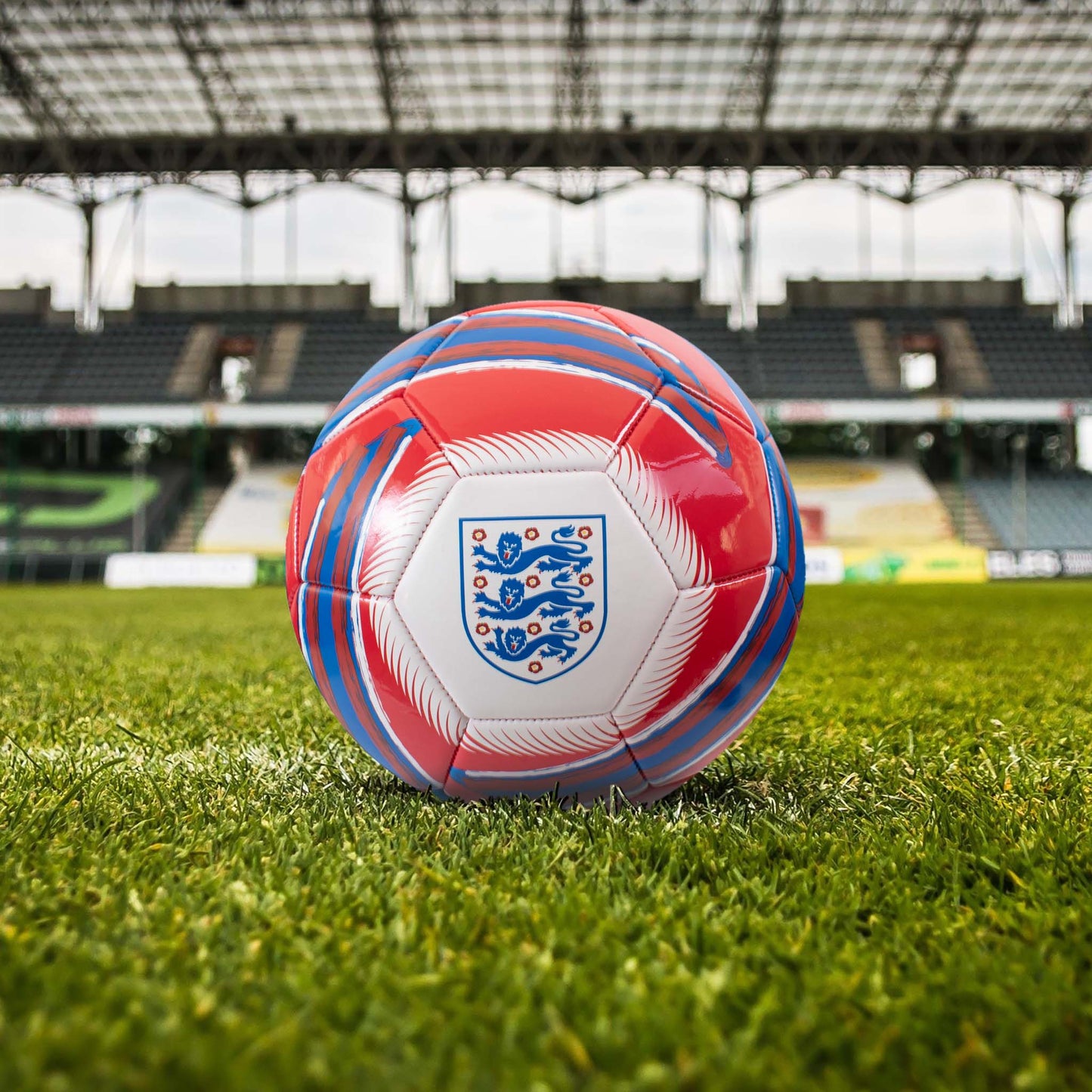 Officially licensed England FA Cyclone Football in red, white and blue with three lions logo in a stadium setting.