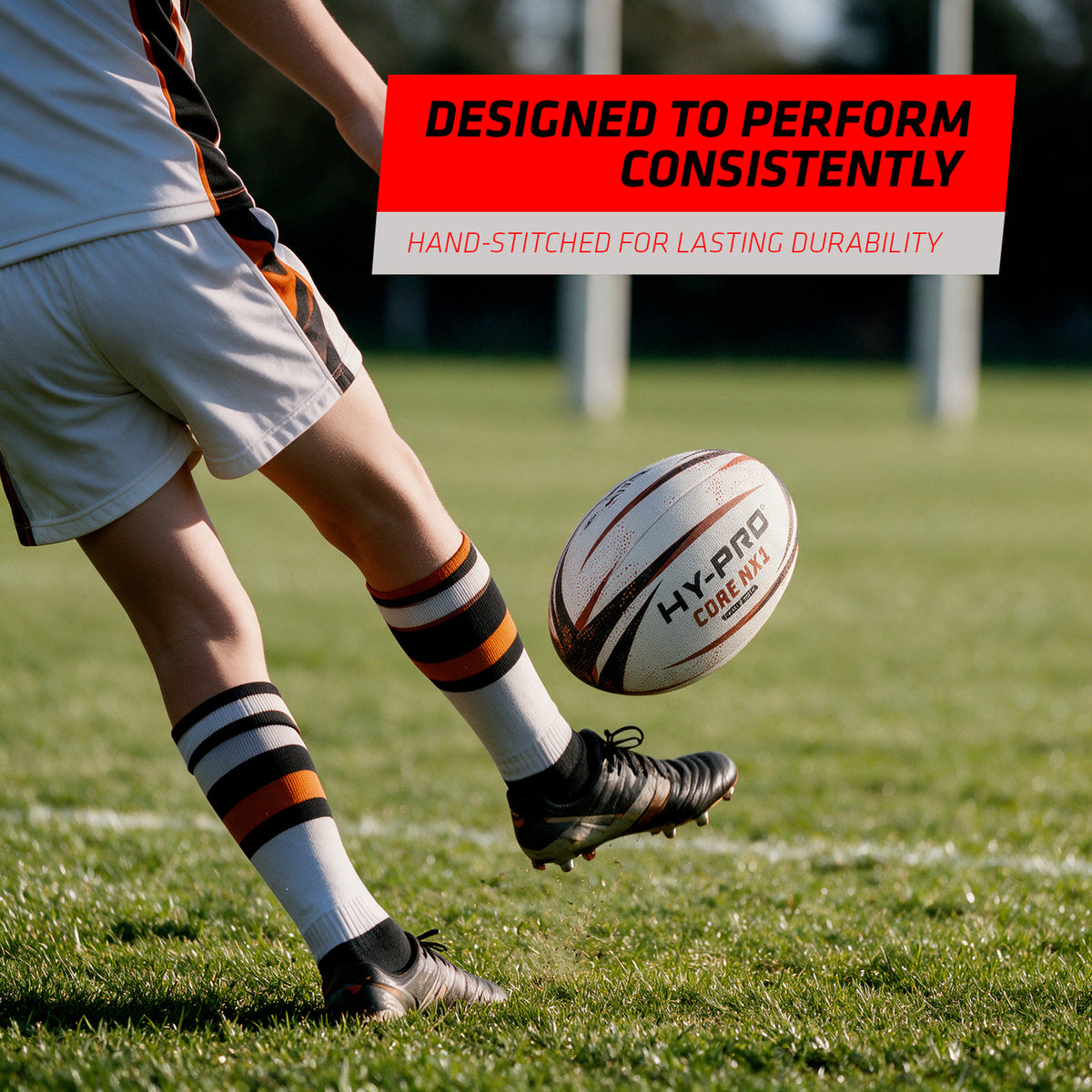 Hy-Pro Core NX1 Rugby Training Ball being kicked on a grass playing field with copy reading 'DESIGNED TO PERFORM CONSITENTLY'