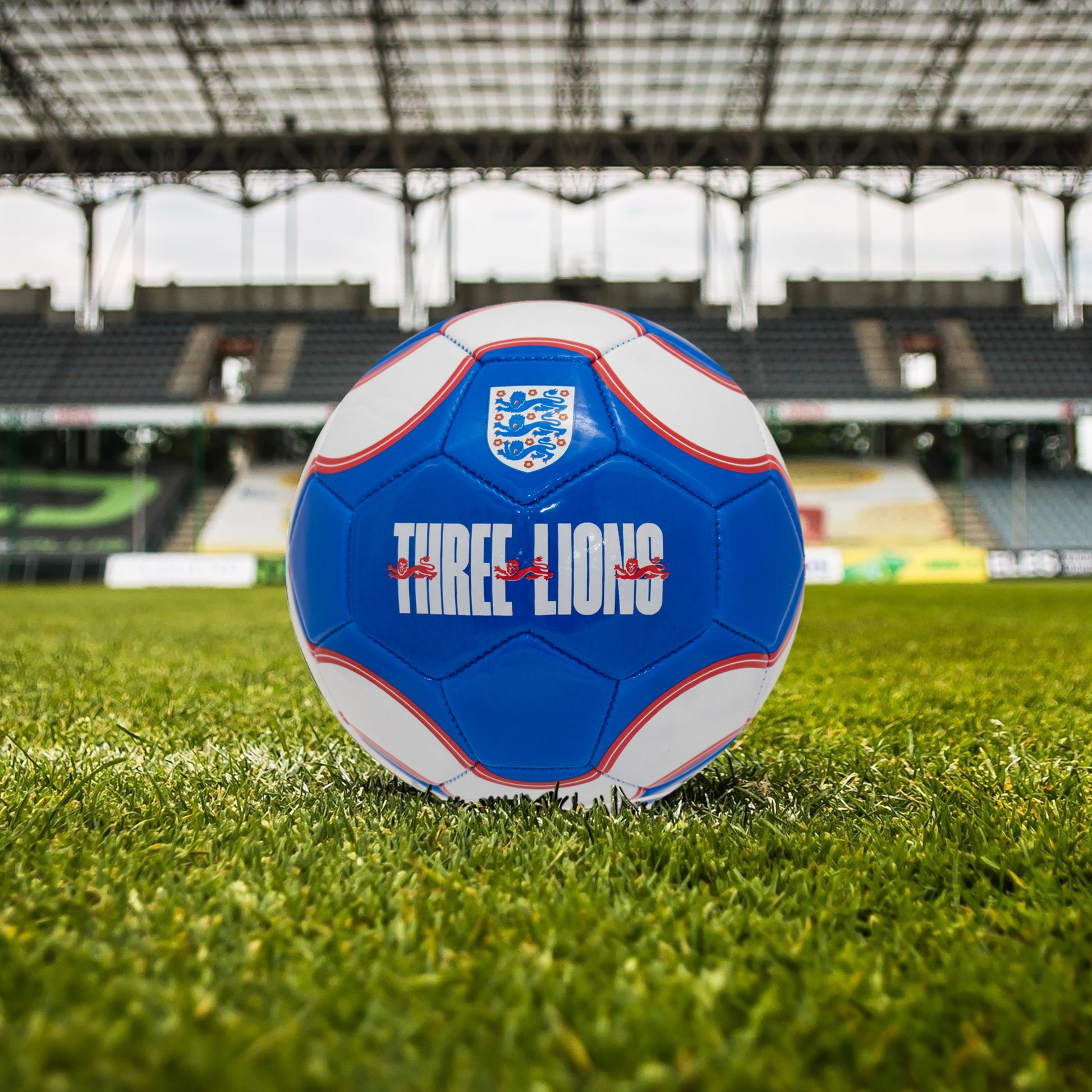Official England FA Merchandise, three lions football in blue and white by hy-pro sports on a grass football pitch
