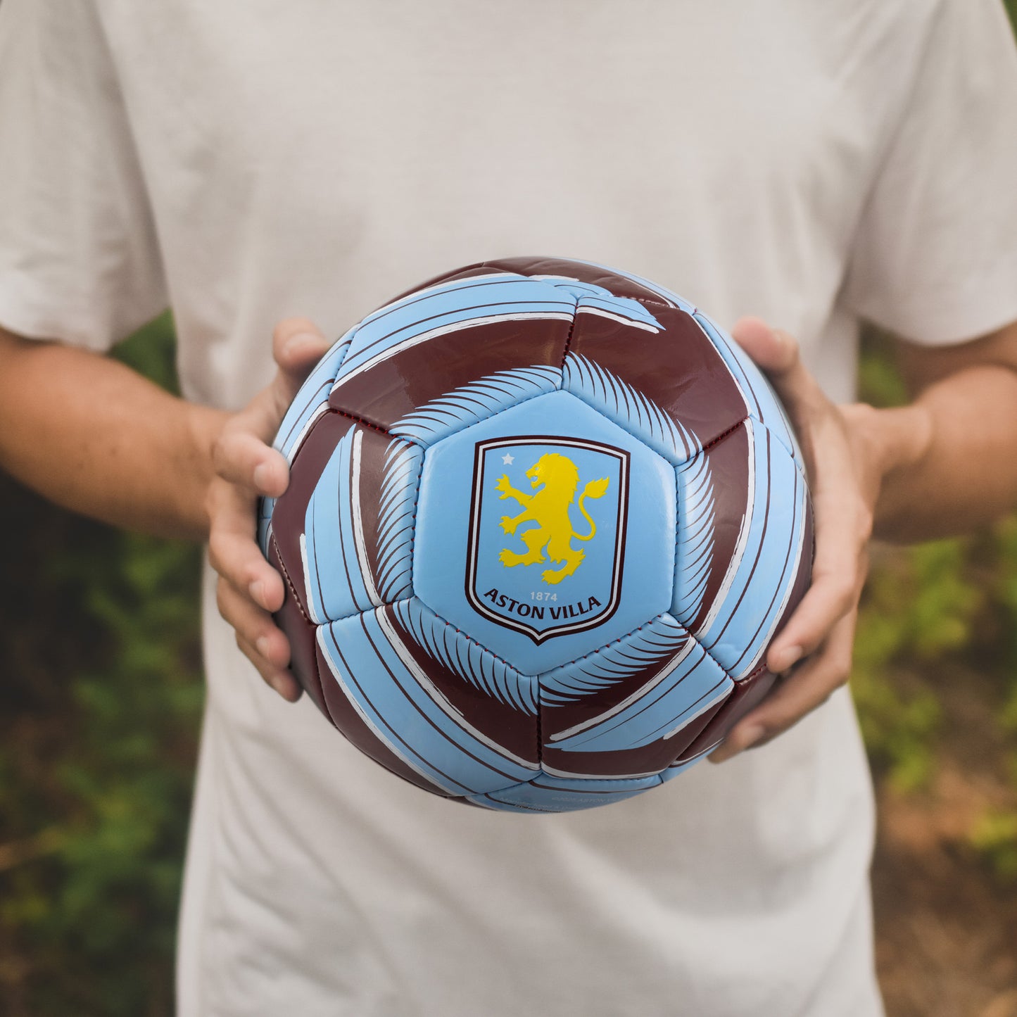 Hy-Pro Officially Licensed Aston Villa F.C. Cyclone Football being held by a fan 