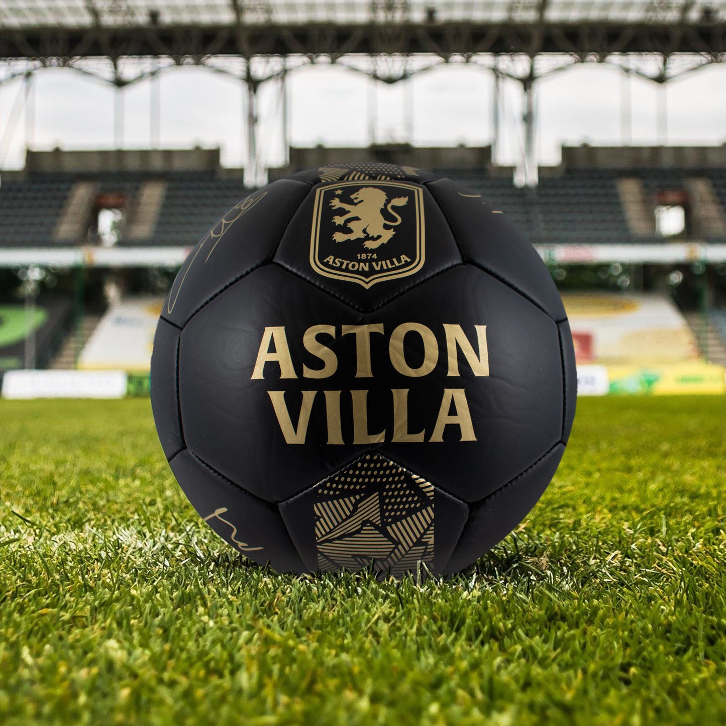 Official Aston villa size 5 football by Hy-Pro Sports in Phantom Design with gold signatures on a grass football pitch