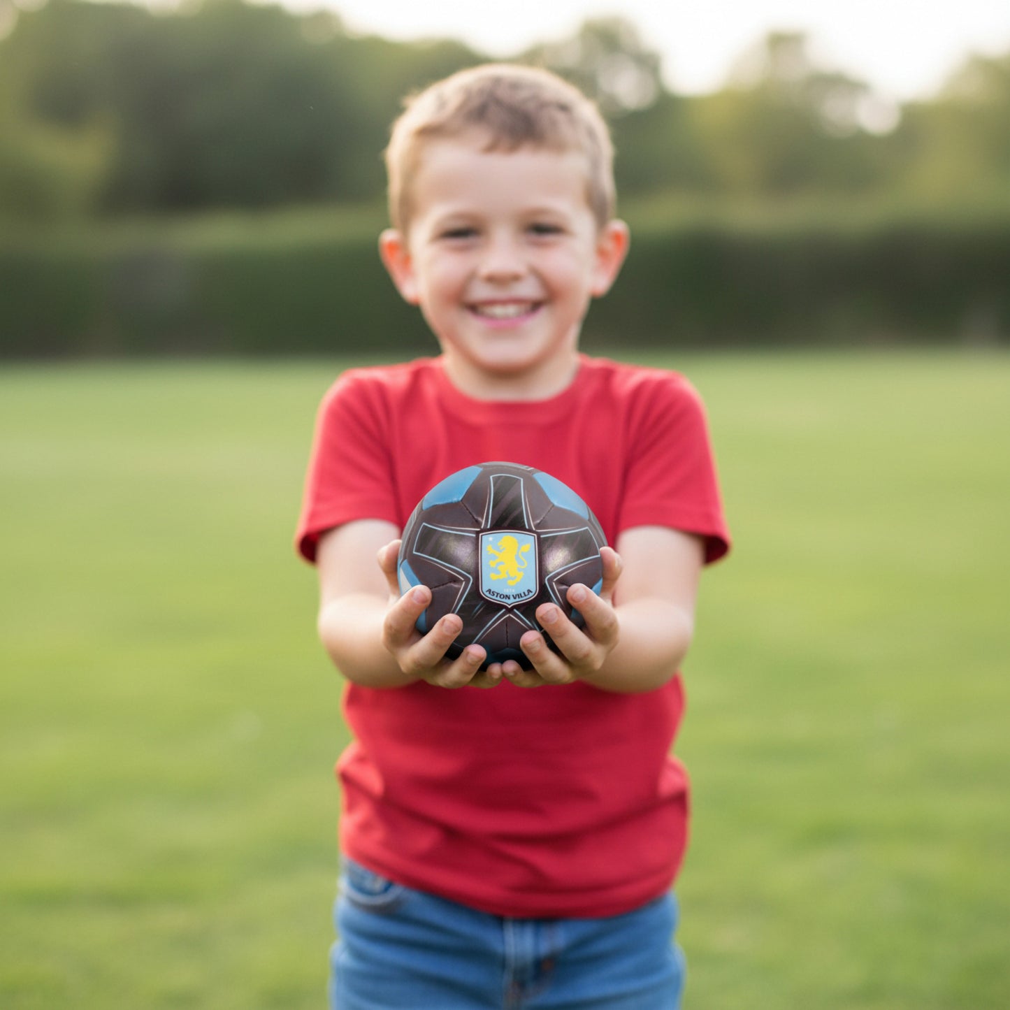 Officially licensed Aston villa soft ball being held by a small child