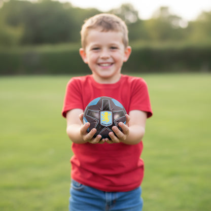Officially licensed Aston villa soft ball being held by a small child