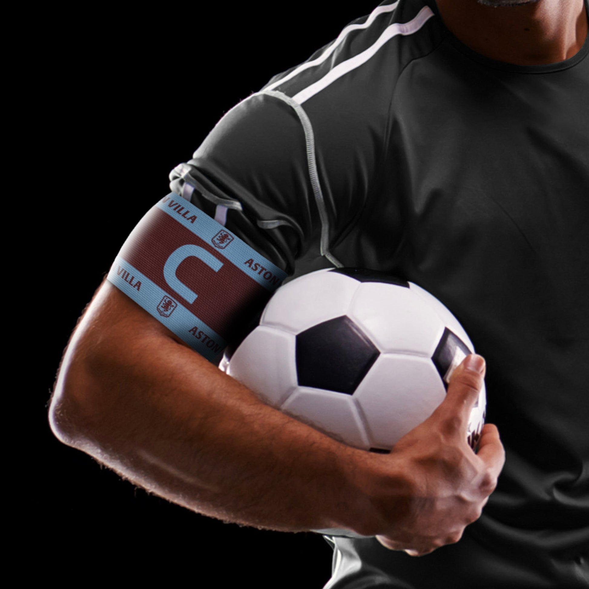 Hy-Pro Official Aston Villa - captains armband IN blue and burgundy on the arm of a football player holding a football