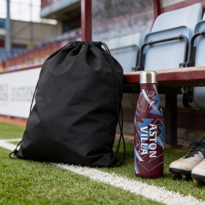 Officially licensed Aston Villa thermal water bottle by Hy-Pro Sports pitch side next to a gym bag and football boots