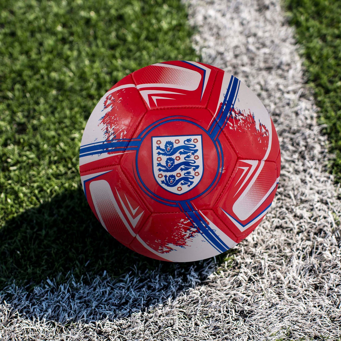 Officially licensed England FA Turbine size 1 football in Red and white with 3 lions crest by Hy-Pro Sports on a grass football pitch