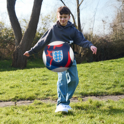 Officially licensed England 3 lions skill trainer being kicked towards camera whilst being worn by a young boy