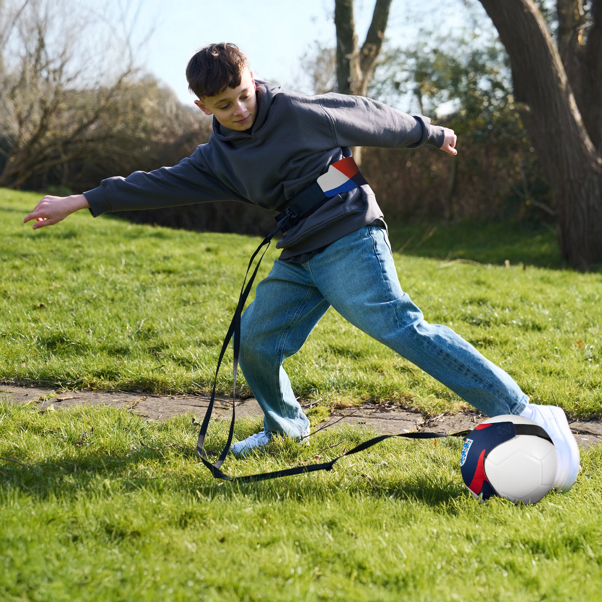 Young boy training football skills using the officially licensed England Skills trainer 