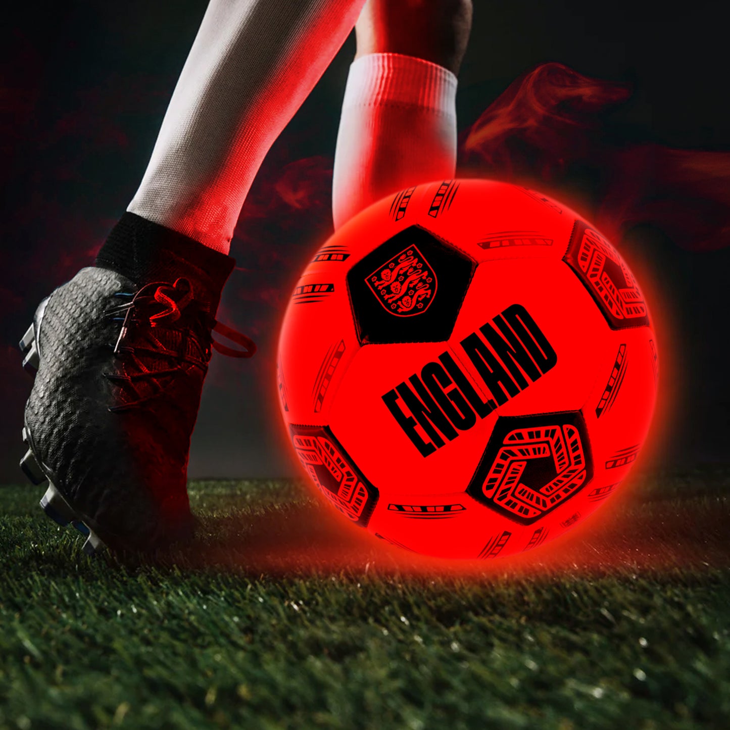 Officially licensed England FA football in neon orange glow in the dark design by hy-pro sports glowing while being used outside whilst dark