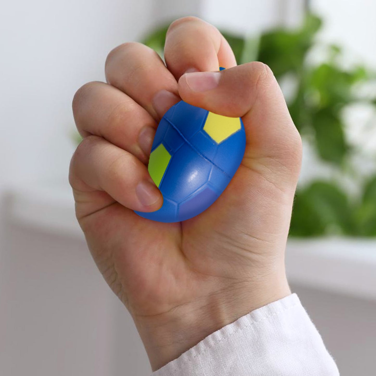 Official FIFA World Cup 2026 stress ball by HY-PRO SPORTS in Blue being squeezed