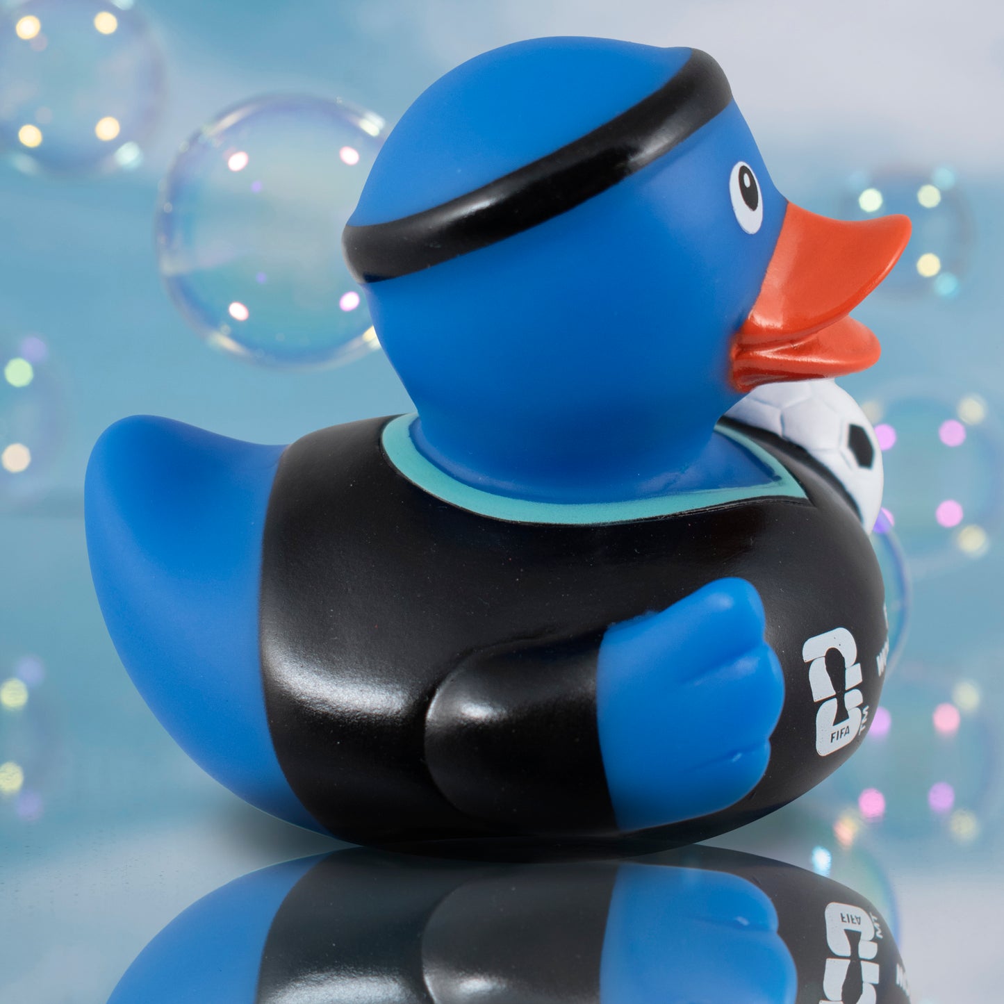 SIDE VIEW OF OFFICIAL FIFA WORLD CUP 2026 RUBBER DUCK BY HY-PRO SPORTS ON A BLUE BUBBLE BACKGROUND