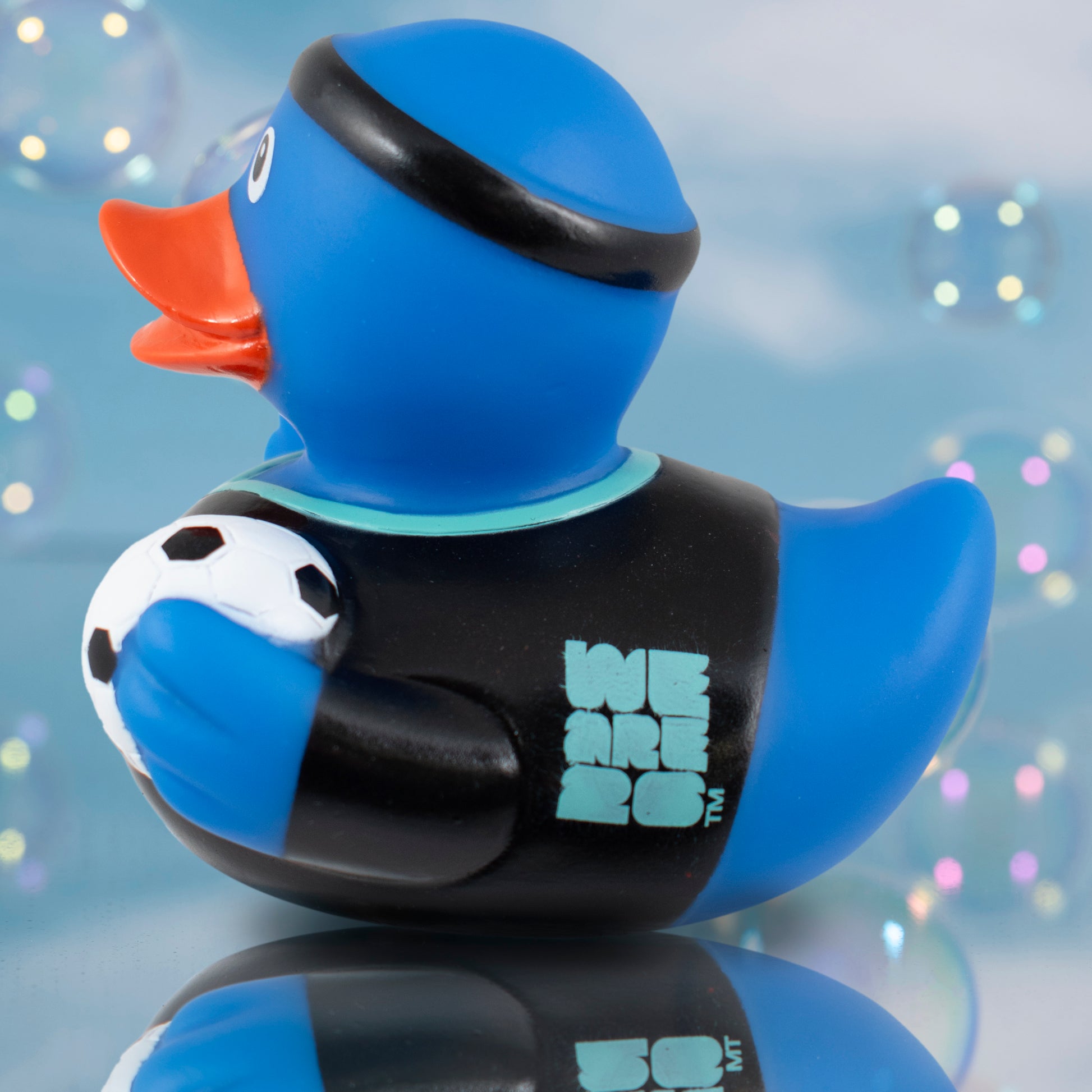 SIDE VIEW OF OFFICIALLY LICENSED FIFA WORLD CUP 2026 RUBBER DUCK BY HY-PRO SPORTS ON A BLUE BUBBLE BACKGROUND