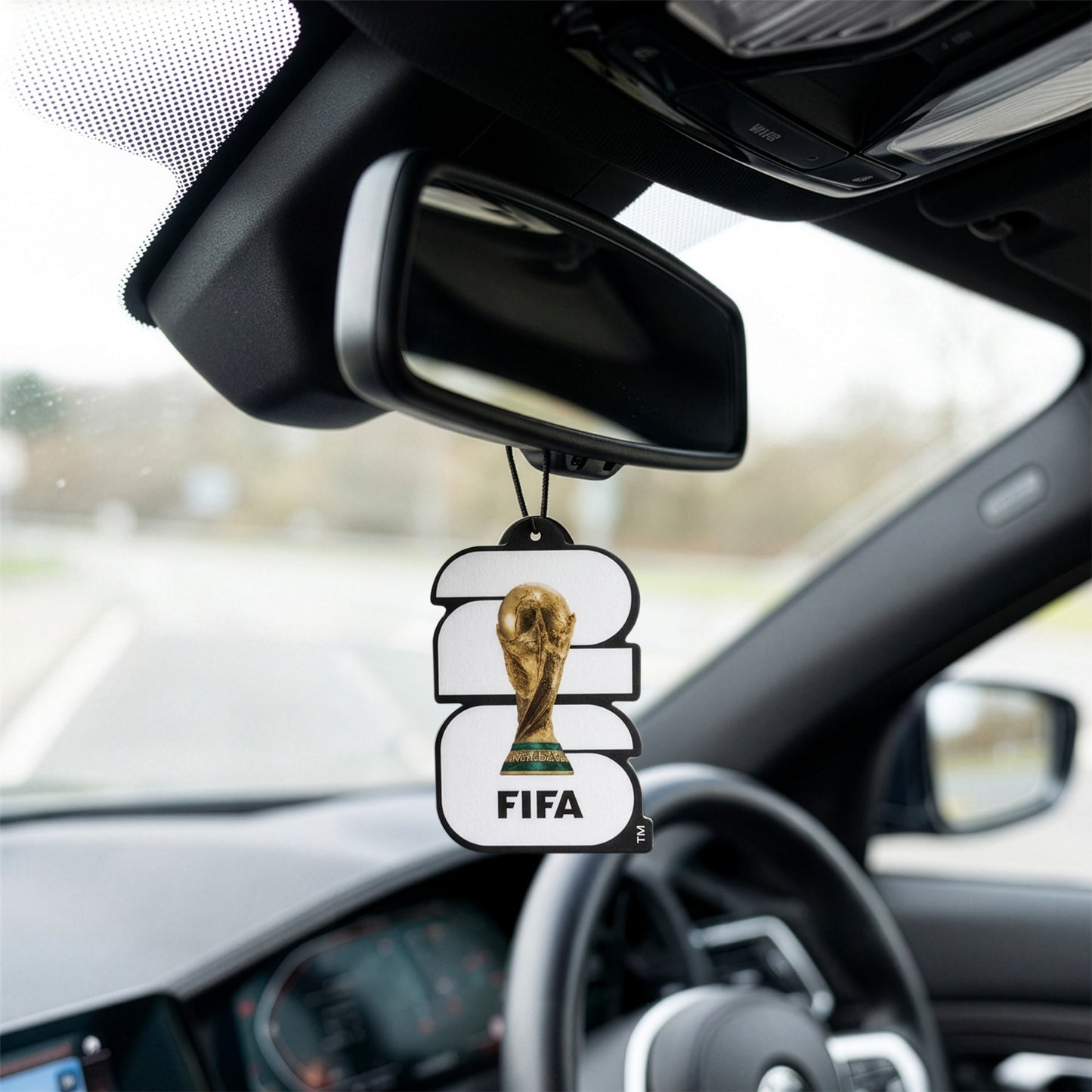 OFFICIALLY LICENSED FIFA WORLD CUP 2026 AIR FRESHNER IN BLACK AND WHITE HANDING FROM A CARS REAR VIEW MIRROR