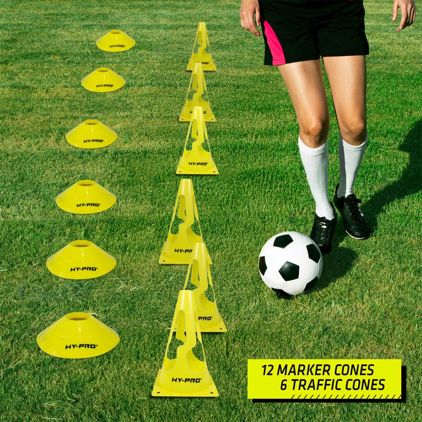 Hy-Pro marker cones and training traffic cones lined up next to a football layer on a grass background. Perfect for agility drills.