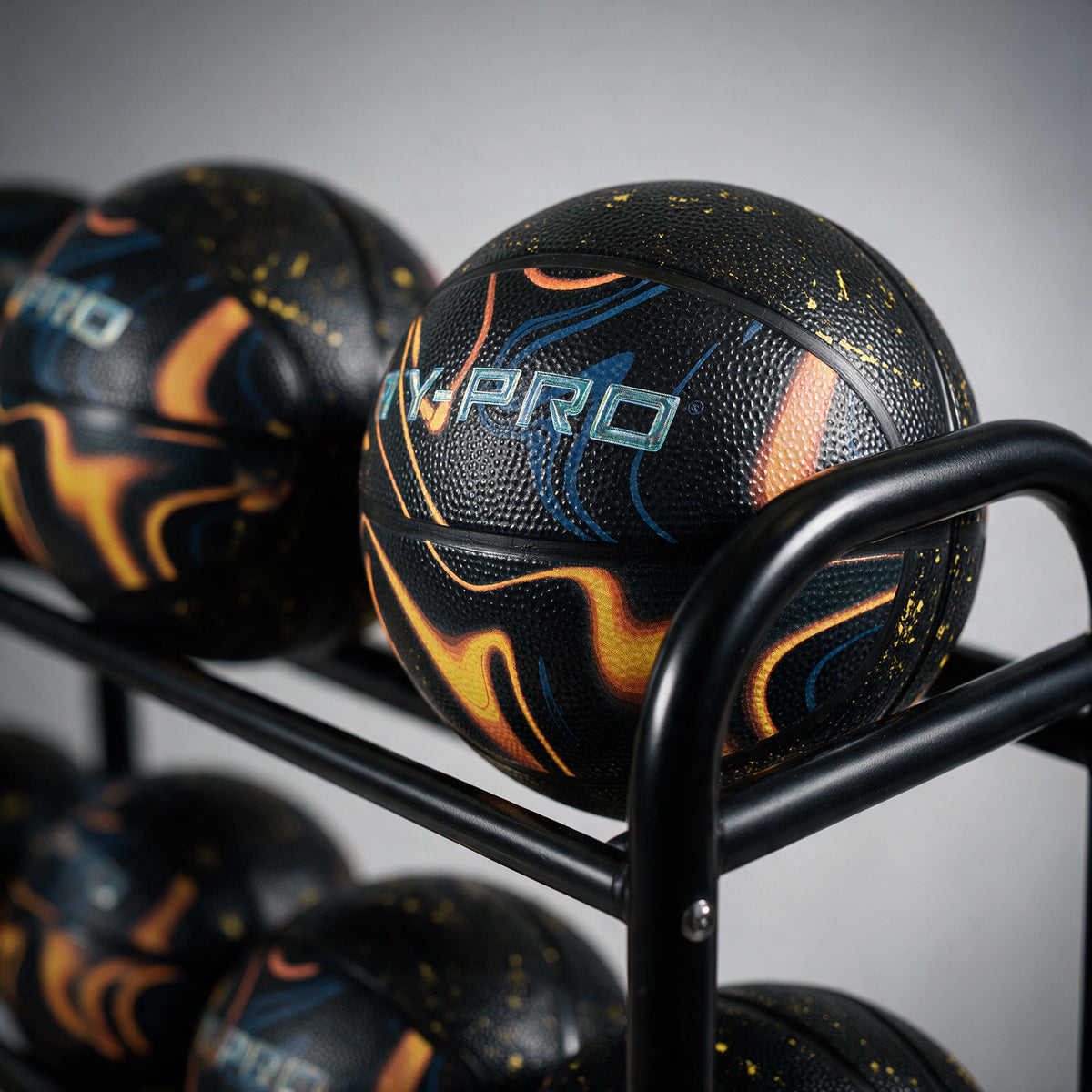 Hy-Pro size 5 orbit basketball on a ball rack  with a grey background