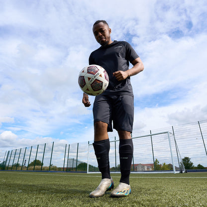 Hy-Pro Official FIFA Quality Approved, Match, Size 5 Football ball being kicked in the air on an Astroturf football pitch