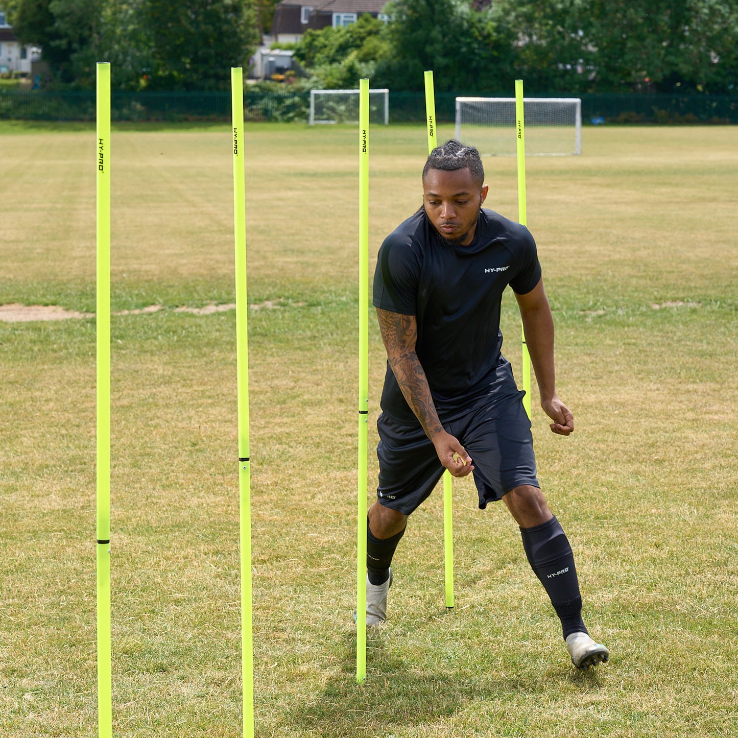 Hy-Pro Sports agility poles on a grass pitch being used to improve speed and agility 