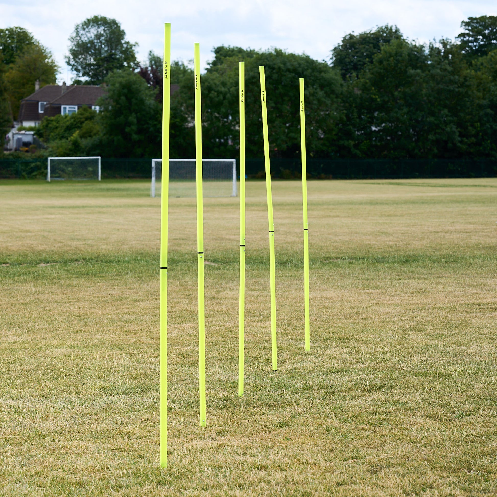 Hy-Pro Sports Yellow agility poles on a grass football field 