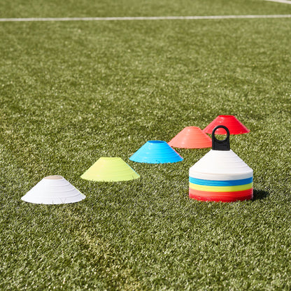 Hy-Pro Sports 50pk of colourful training cones laid out in a line on a grass pitch showing the 5 different colour ways 