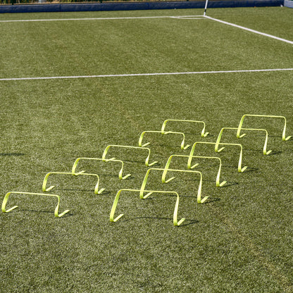 Hy-Pro Sports flat agility hurdles lined up side by side on an Astroturf pitch