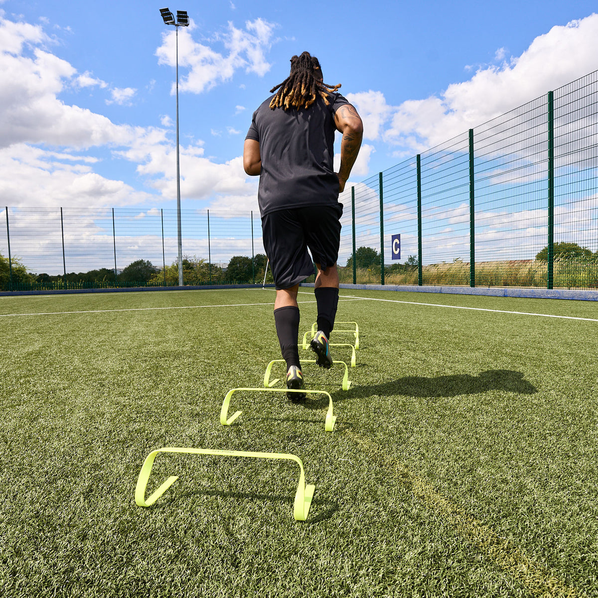Hy-Pro Sports Yellow Agility Hurdles being used on a football pitch