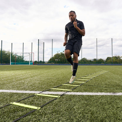 Hy-Pro Sports yellow agility ladder being used by a footballer on a football pitch