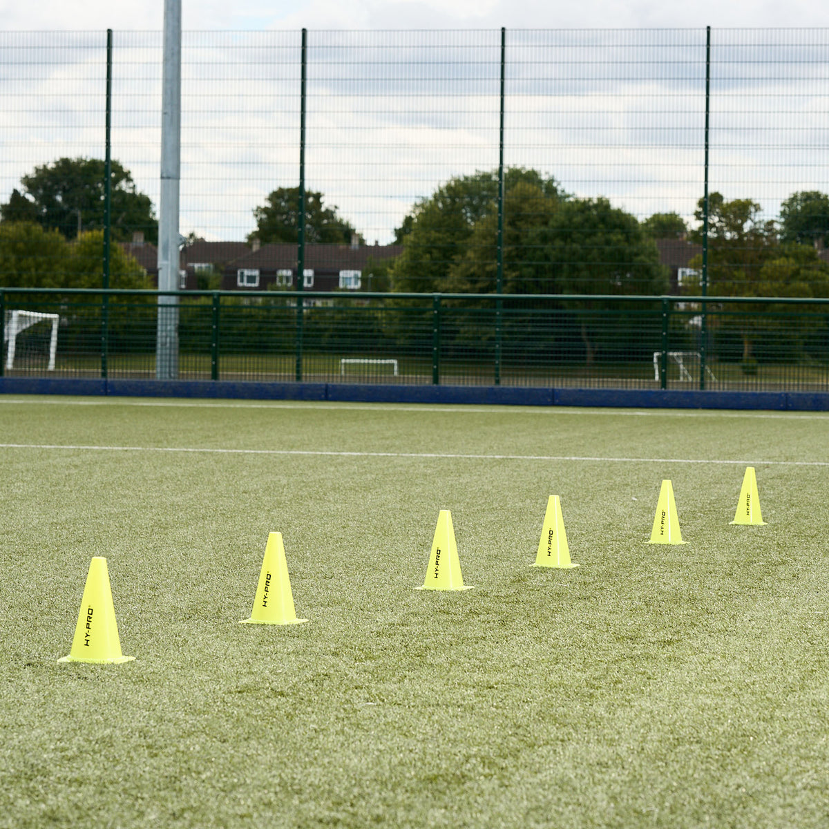 Hy-Pro sports cones lines up on a football pitch ready for a training session